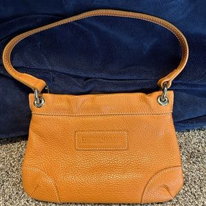 Dooney and Burke Vintage small orange shoulder bag.